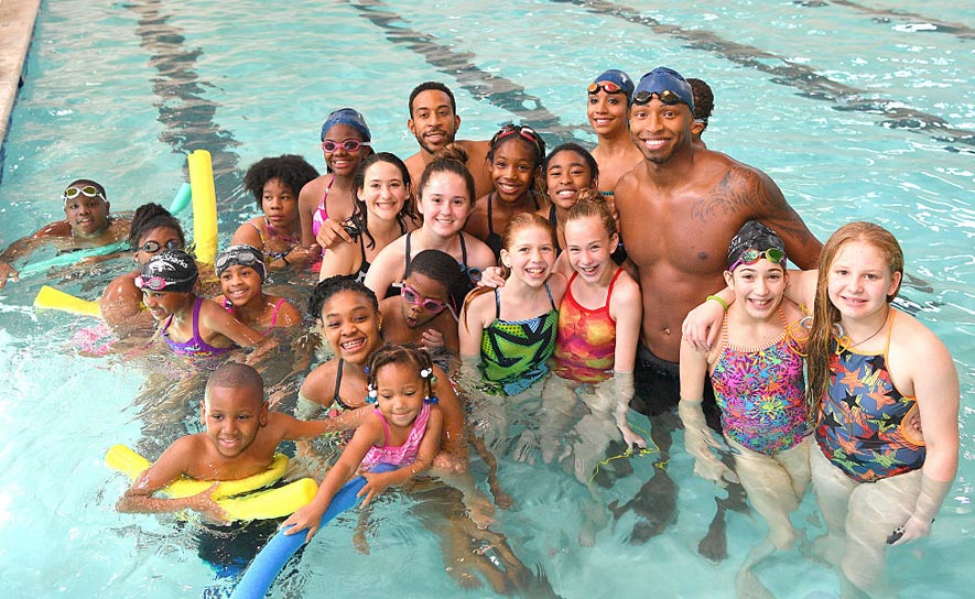 Maritza Correia McClendon, Cullen Jones and Ludacris with Kids from Carrie Steele Pitts Life Learning Center
