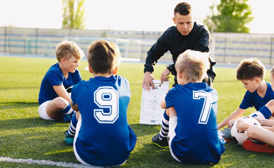 Coach and Soccer Players
