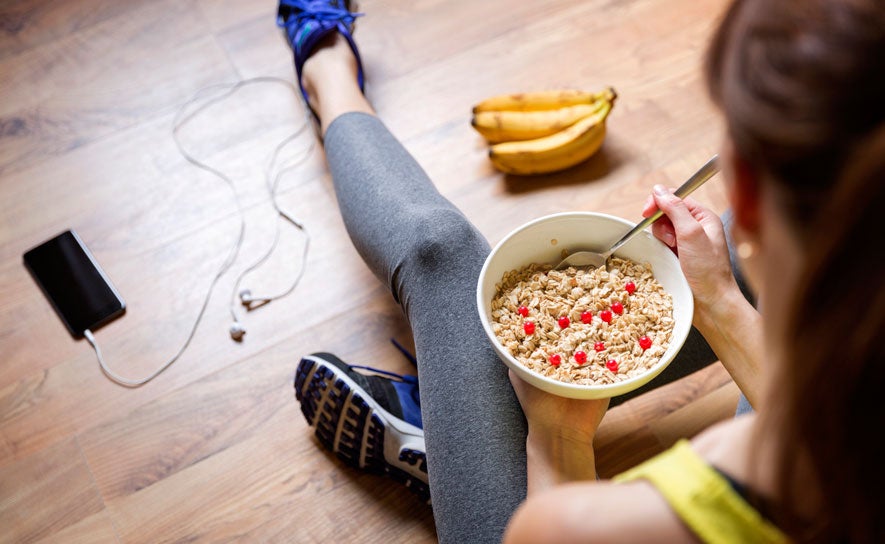 Woman Eating Cereal After Workout