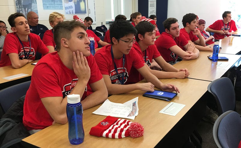 mensselectcamp1 Swimmers at the 2018 National Select Camp listen to a presentation.